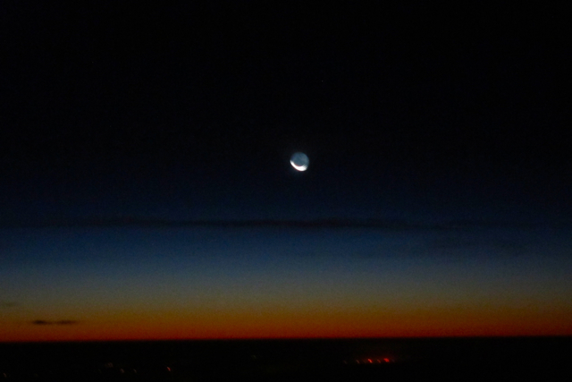 moon and sun rise over The Gulf